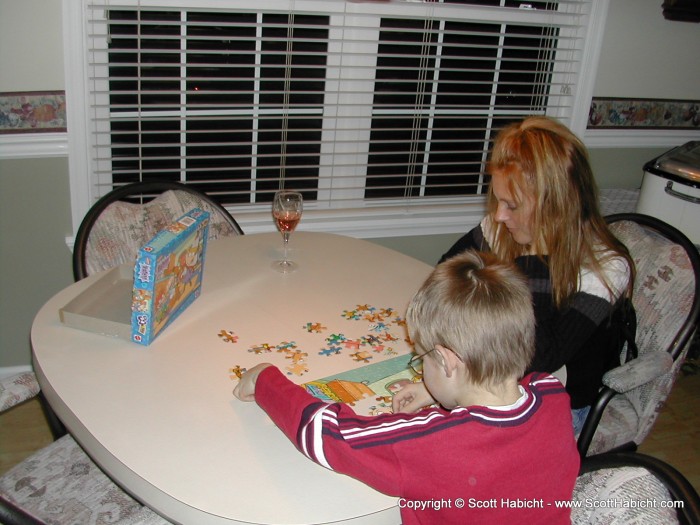 After dinner, Kelli and Christopher did a puzzle.