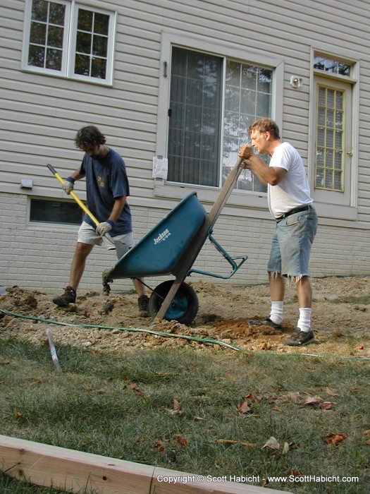 Next, my father came over and we filled the holes with cement.