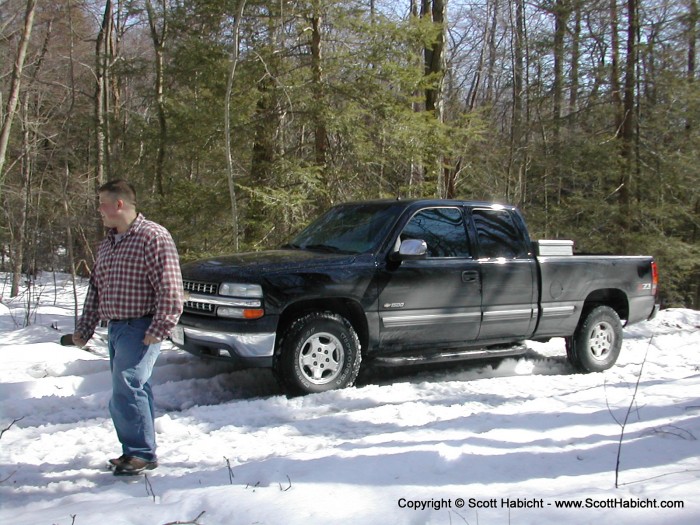 All four of us got on his bumper and bounced his truck while he drove it in reverse out of the ditch.