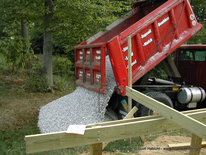 The truck ejects the white.....stone.