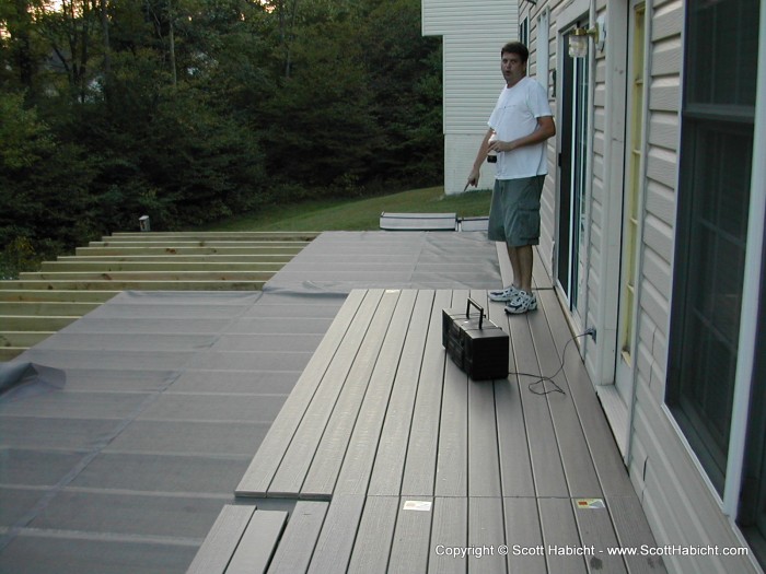 Here Rob and I have rolled out the screen (to keep the bugs from coming up) and have laid down some of the decking.