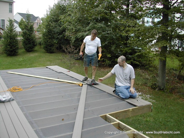 After putting the rim joists on, we can now start putting down the decking.