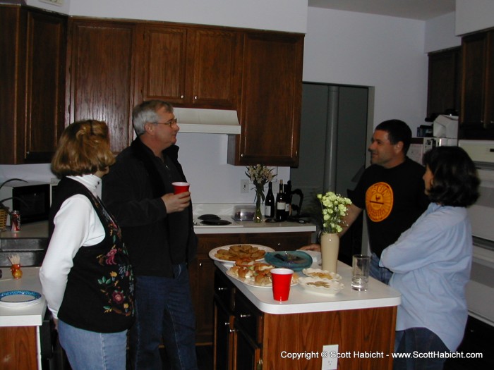 These two couples came seperately, and found out they lived two doors down from each other.