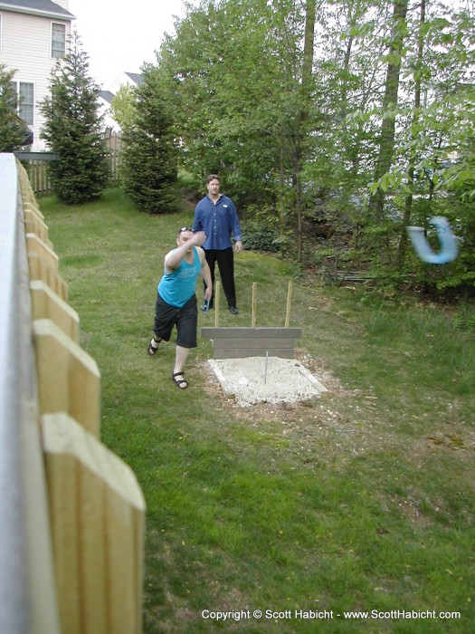 Brian and Scott pitchin' shoes in the backyard. This one happened to be a ringer.