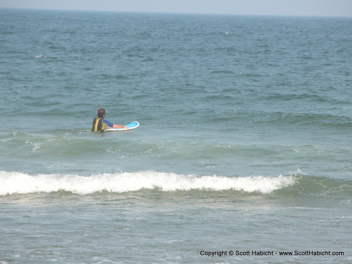 I slipped into the ocean to master the art of surfing.