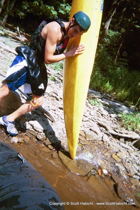 Matt Augustin brought a kayak along instead of renting a boat. Here, he's emptying the water out of it after falling out.