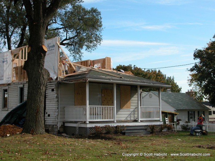 What do you see in this picture of a burned out house?