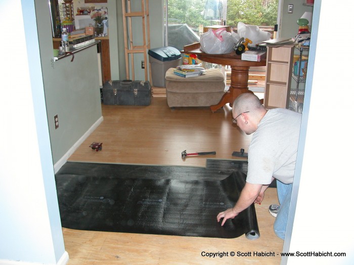 My brother lays some new flooring.