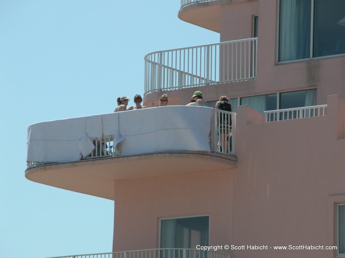 A new day, and these dames are preventing spying while they go topless....