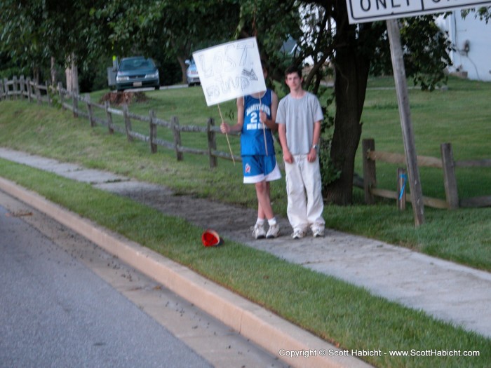 The sign says 'Lost and Found". I have no idea what they were doing.