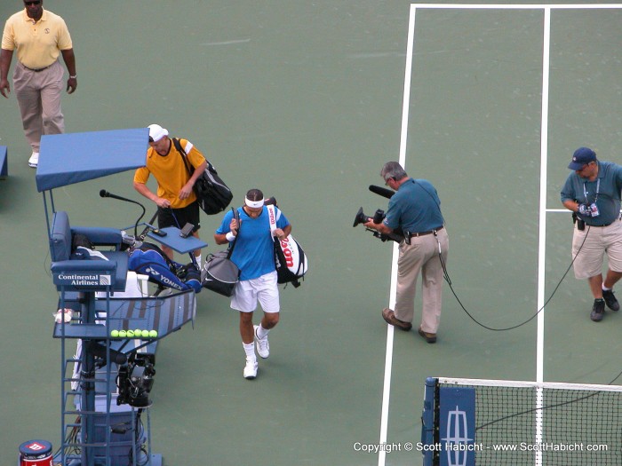 Lleyton Hewitt and Roger Federer take the court.