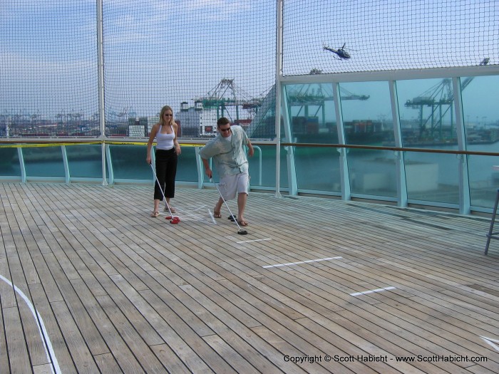 No time to waste in starting some fun, so Delcie and Mike play some shuffle board.