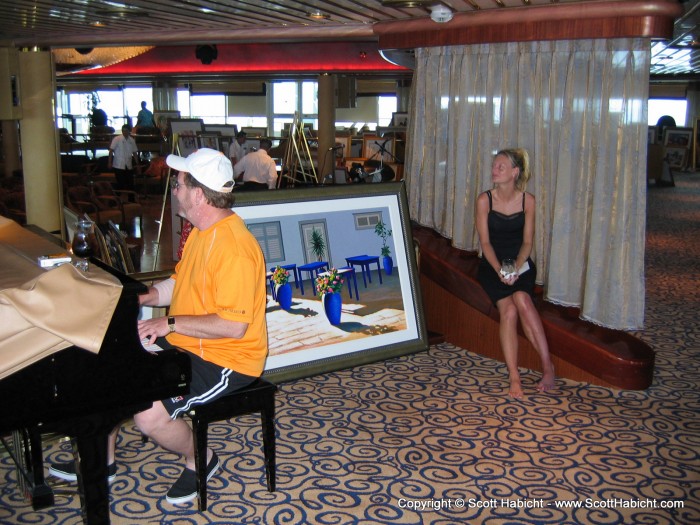 After an art auction, and Kelli listens to the piano while sitting next to our new art.