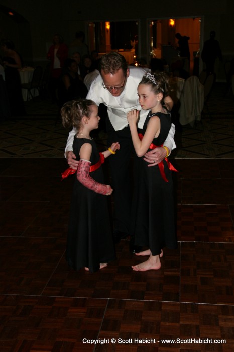 Peter shares a moment with his daughters.