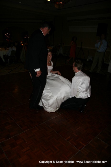 Mike over sees Peter going under the dress for the garter.