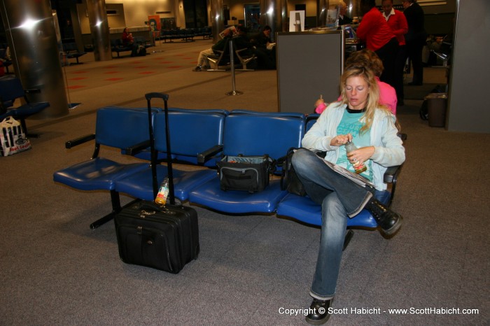 Kelli and I wait at the airport for another vacation.