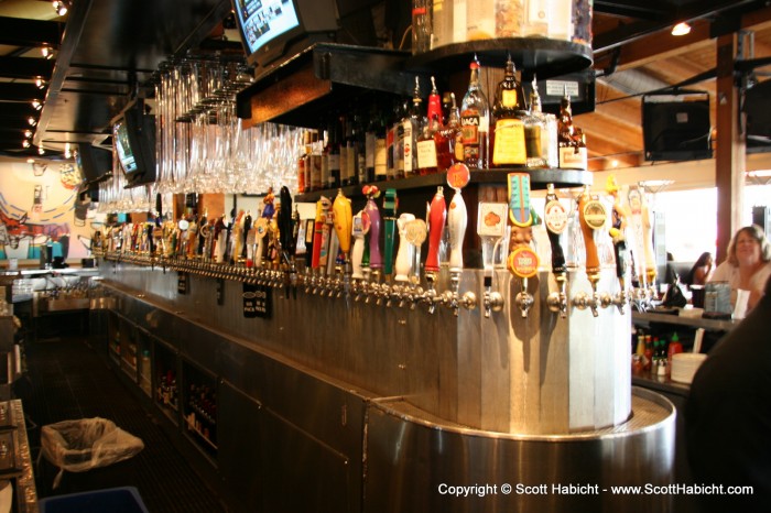 Both sides of the bar are lined with taps.