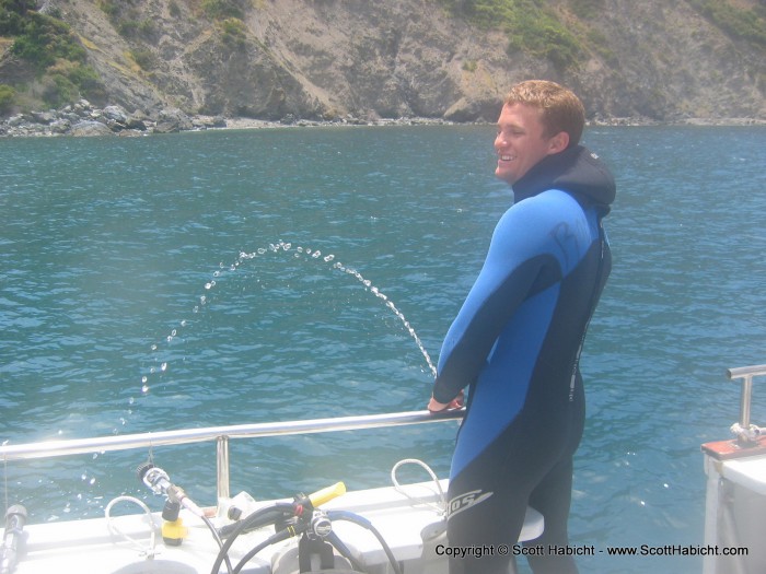 Our divemaster, Chris, letting us know where the salt water rinse was on the boat.