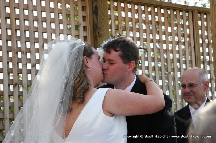 And with this kiss, they're hitched.