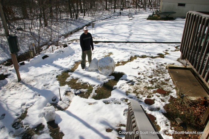 With what was left of the snow, Mark started to make a snowman....