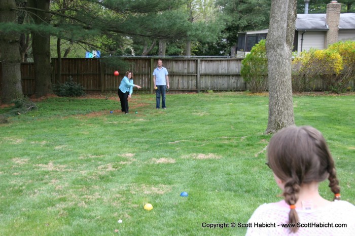 The adults played bocci ball in the backyard....