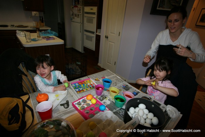 Dyeing eggs, and look Sophia is crying.