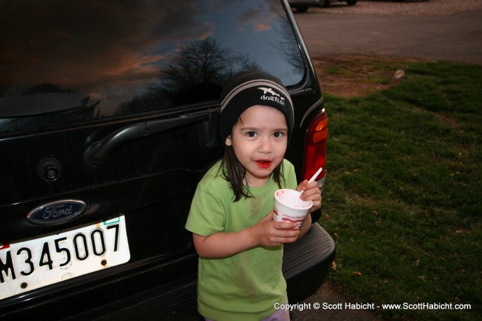 She was getting cold, so instead of not eating anymore, she put on a hat.