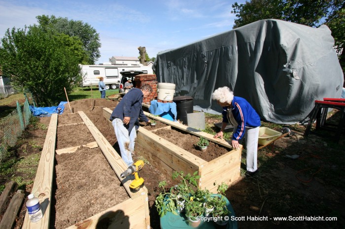 With the garden raised up, she didn't have to lean over so much to tend to the plants.