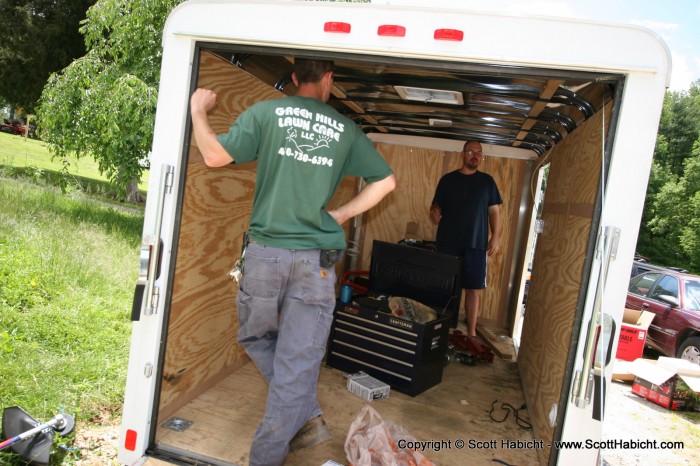 Mathew helped Erin's cousin Matt install some equipment racks in his landscaping trailer.