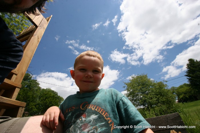 In her defense, he's standing on the first step of the playground.