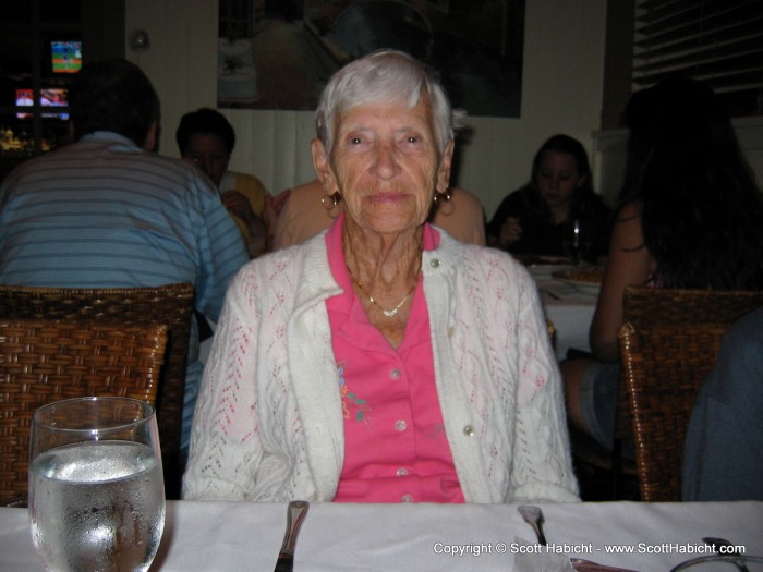 Her grandmother is listening to the conversation behind her.