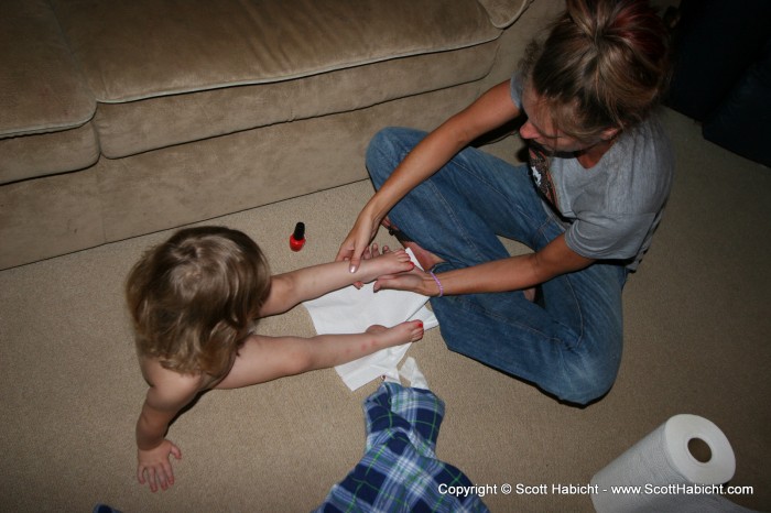 Kelli teaches Amber how to do a pedicure.