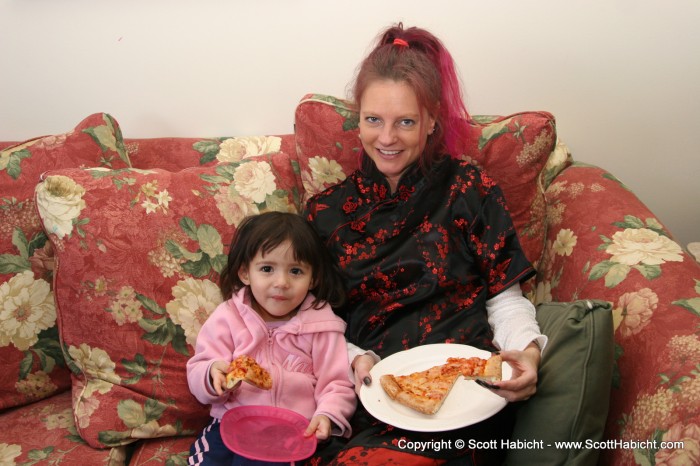 Kelli and Katie enjoy some pizza.