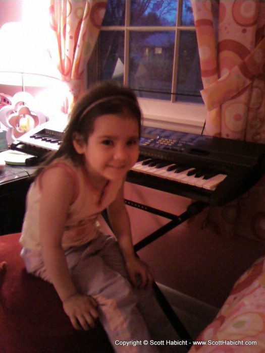 This is Ashley in her room when we were practicing piano.