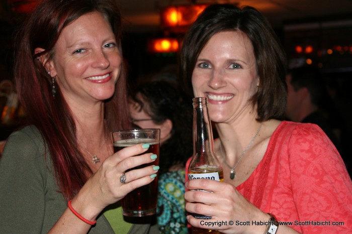 Kelli and Kristi ring in good times with a drink.