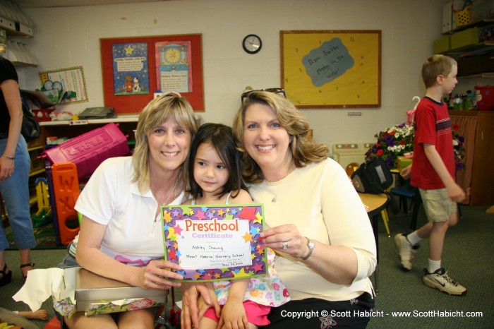 Her diploma with her teachers.