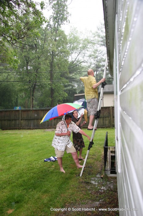 Peter never got around to cleaning the gutters, so the men of the party helped out.