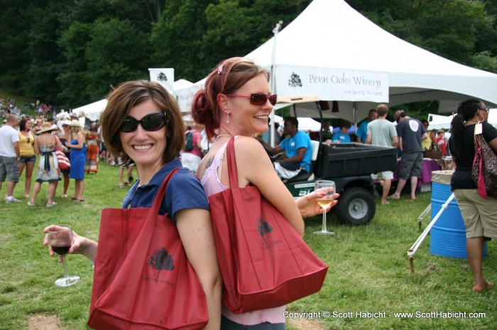 Showing off their wine bags.