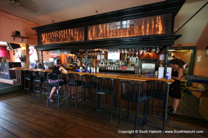 and into the Carmen Verandah, a "locals" bar.