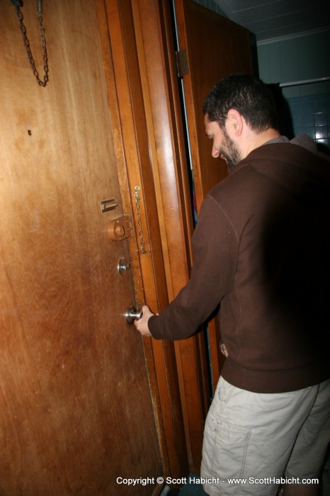 Chris was still having trouble opening the door.