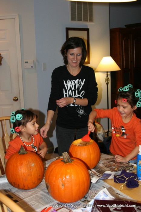 And while waiting for their hair to curl, they had time to carve the pumpkins.