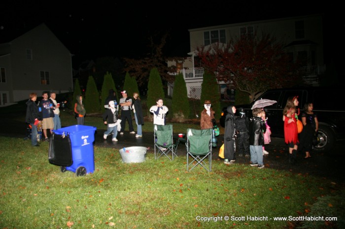 Giving away lots of candy to the children and beer to the adults tends to attract a crowd.