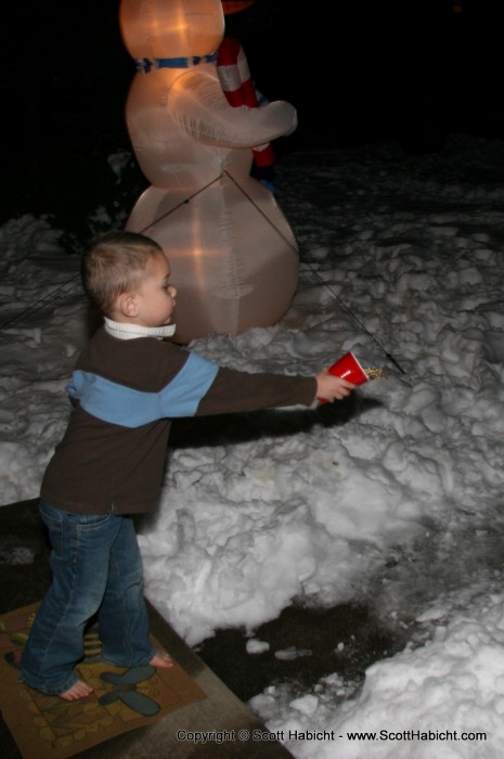 With the mix ready, Taylor threw it into the front yard.