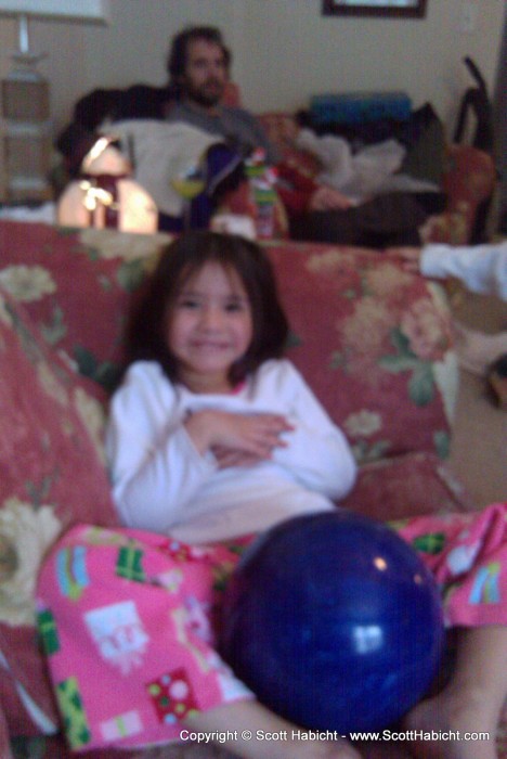 Ashley poses with the bowling ball.