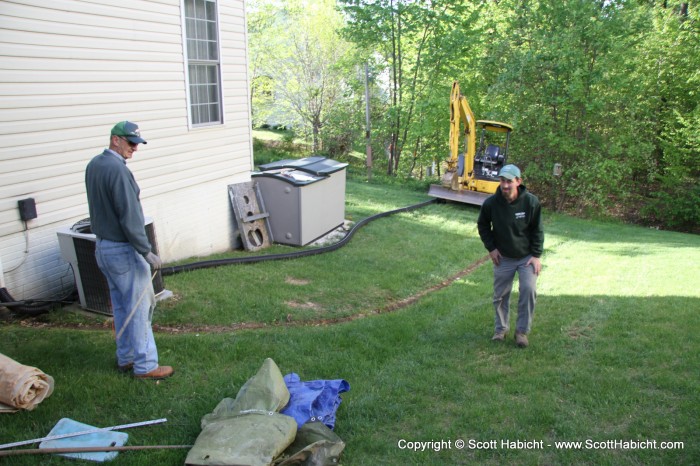 10 years in my house, and I'm finally burying the sump pump pipes.