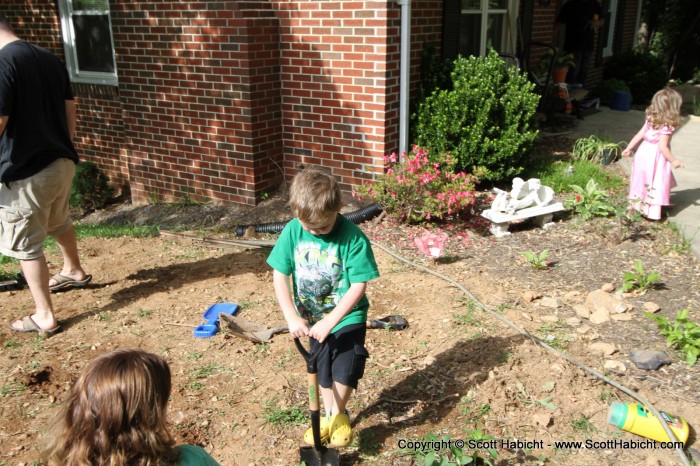 They are planting a garden, and everyone was pitching in to help.