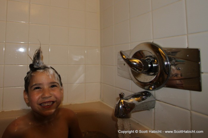 Later, during bath time, Ashley had fun with her hair. Notice the missing tooth?