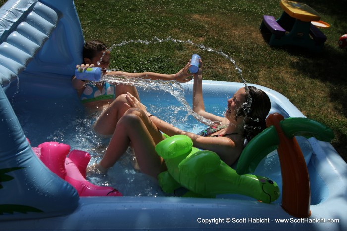 And splashing your sister seems to be a great way to enjoy the pool.