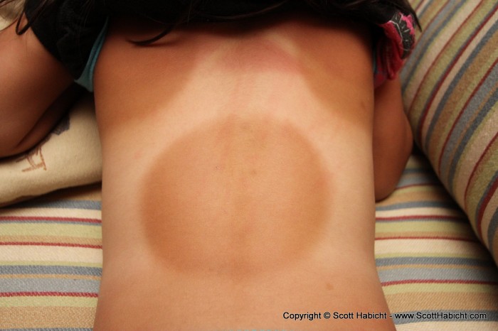 Check out Ashley's tan line. We should have put a butterfly sticker in the middle of the circle while she was in the sun.