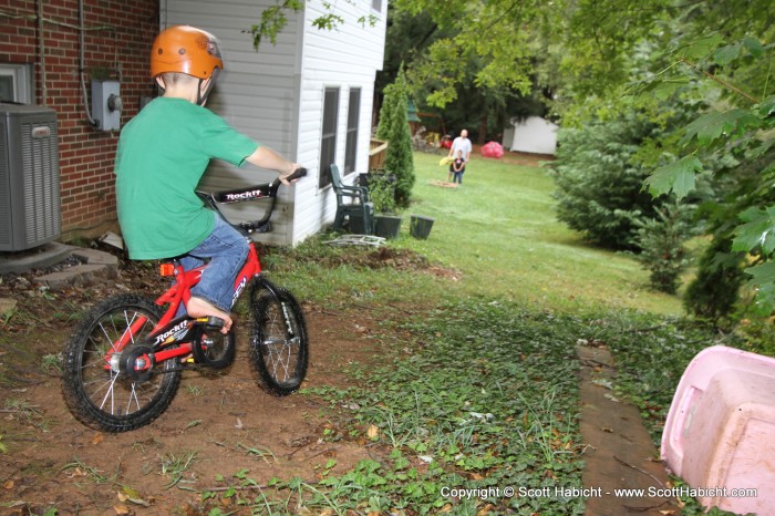 He then had to one-up her and show her how to ride down a dirt hill.